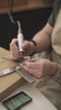Goldsmith making a ring by hand